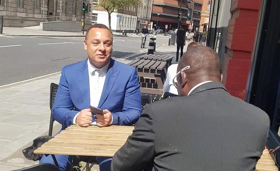 10 Fancy a REAL Blind Date? Two men chatting outside a coffee shop
