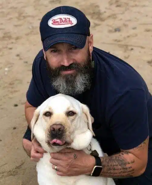 20 Fancy a REAL Blind Date? Man with beard and golden lab dog