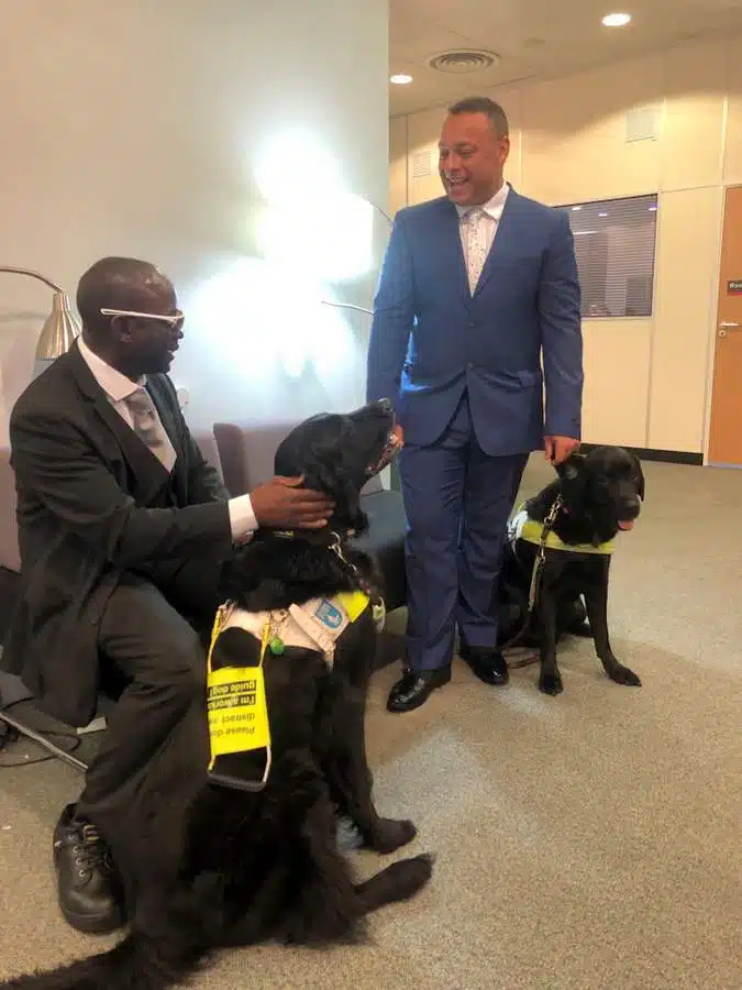 42 Fancy a REAL Blind Date? 2 men with black guide dogs