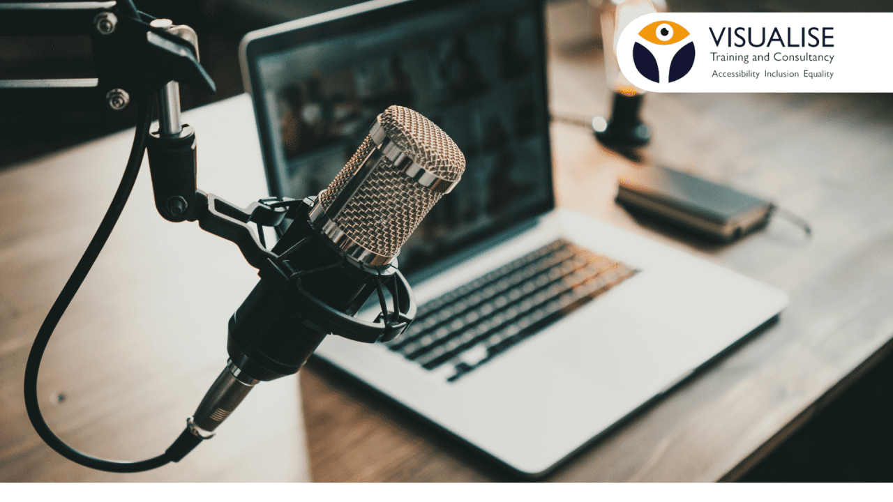 Podcast microphone in front of a laptop